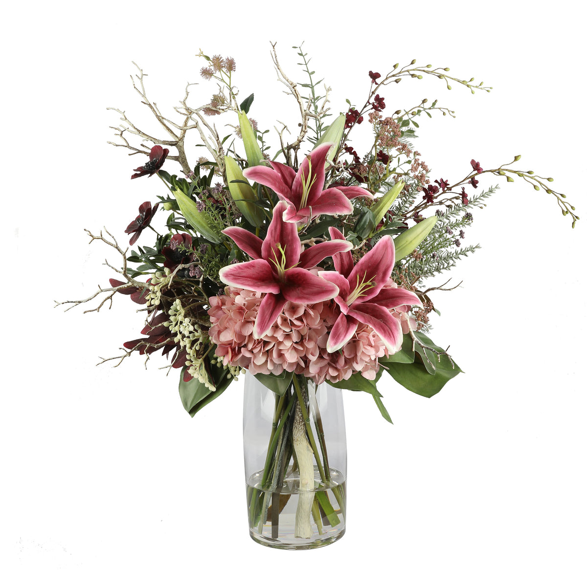 Pink Lily and Hydrangea Wild Artificial Arrangement with deep pink oriental lilies, blush pink hydrangea, dark burgundy orchids, silver branches, and wild foliage in a tall glass cylinder vase
