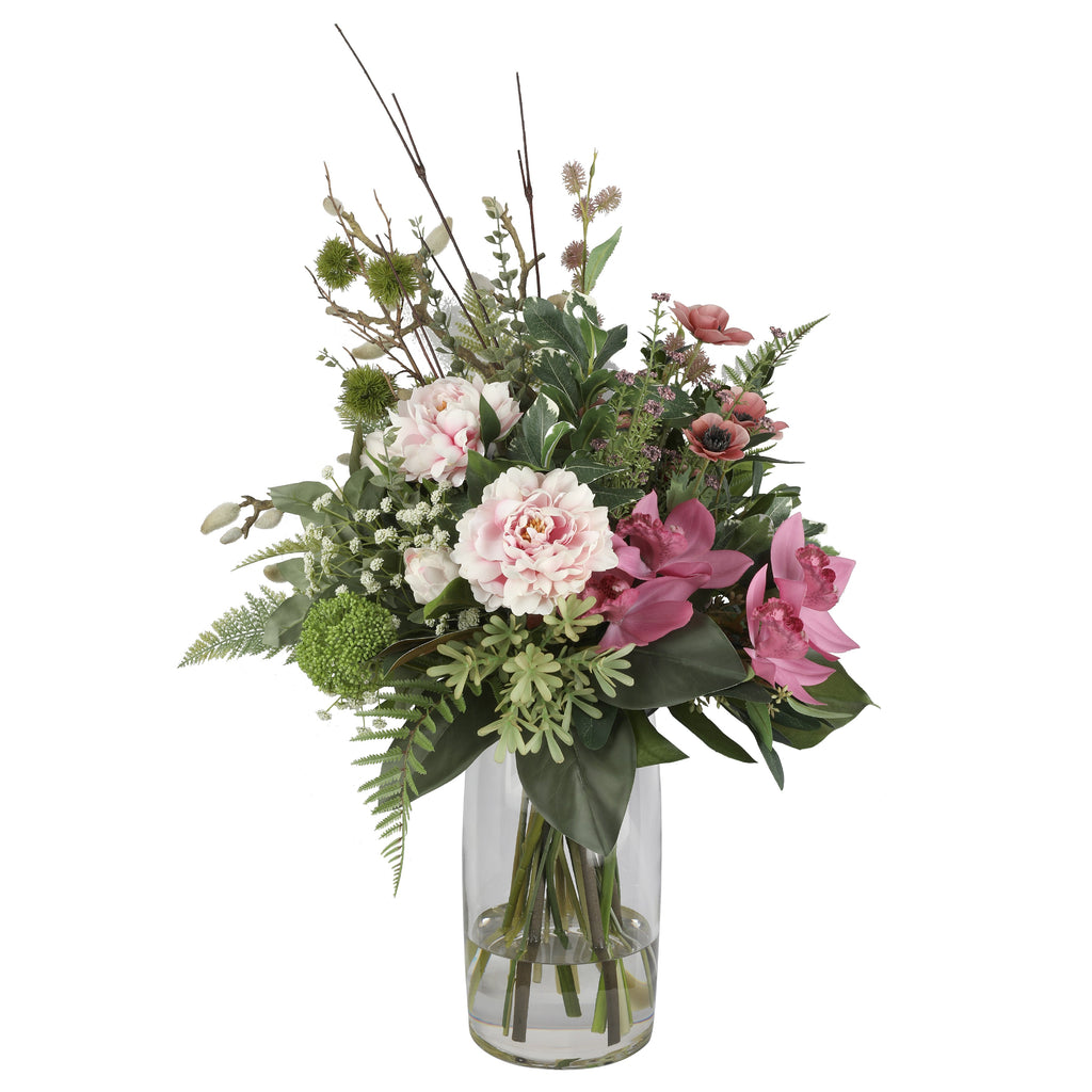 Blush Peony and Orchid Wild Garden Artificial Arrangement with blush pink peonies, deep pink cymbidium orchids, pink anemones, pussy willow branches, and mixed wild greenery in a tall glass cylinder vase