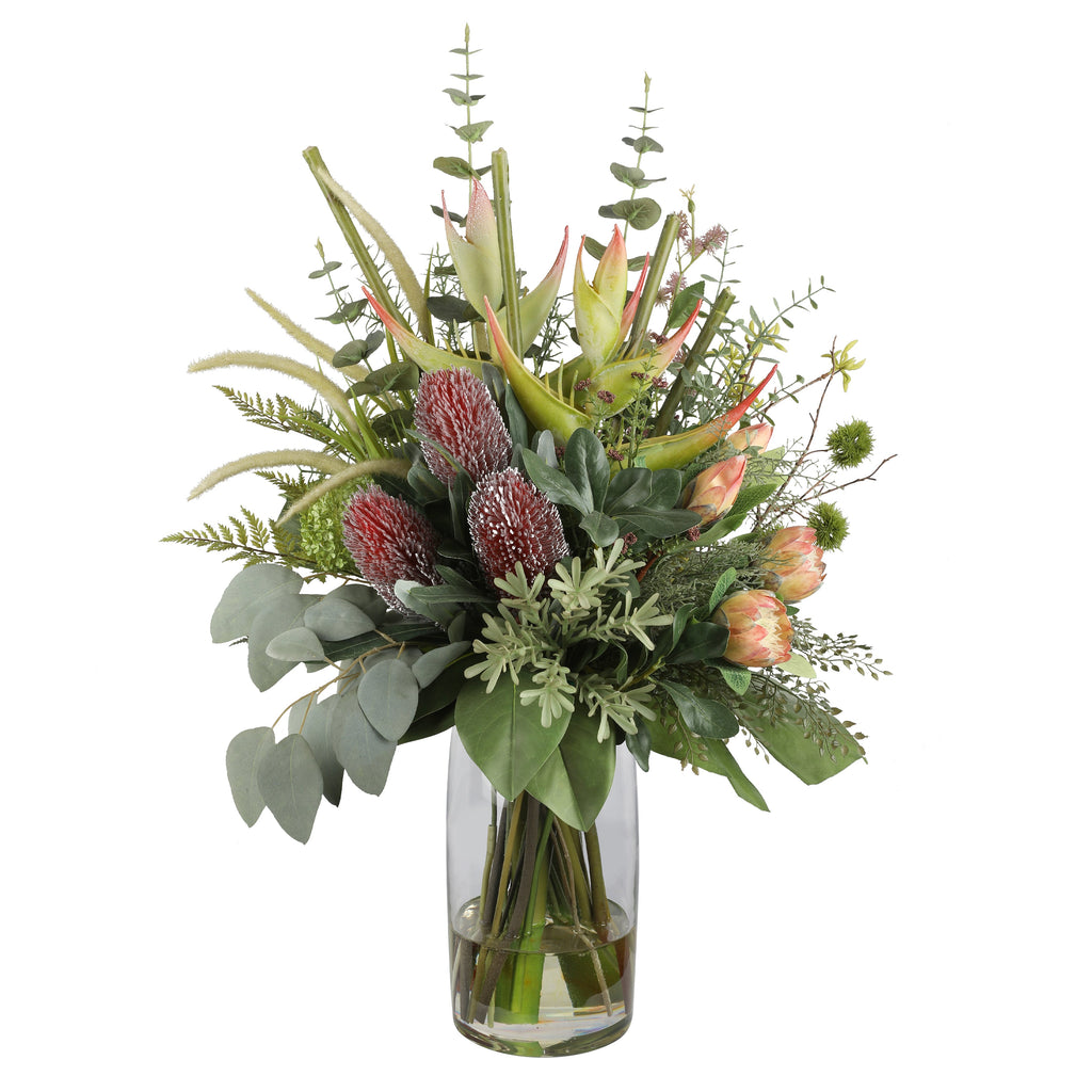 King Protea and Banksia Bush Artificial Arrangement with peach king protea, pink proteas, burgundy banksia cones, heliconia spikes, pampas grass, and native foliage in a tall glass cylinder vase