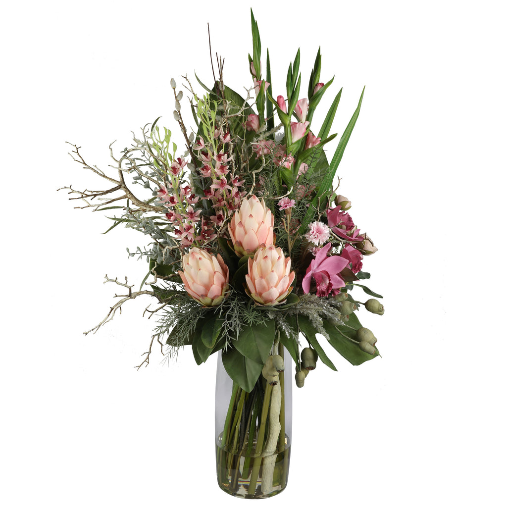 Blush King Protea and Orchid Wild Romance Artificial Arrangement with three blush pink king proteas, pink gladioli, cymbidium orchids, mauve orchids, and mixed foliage in a tall glass cylinder vase