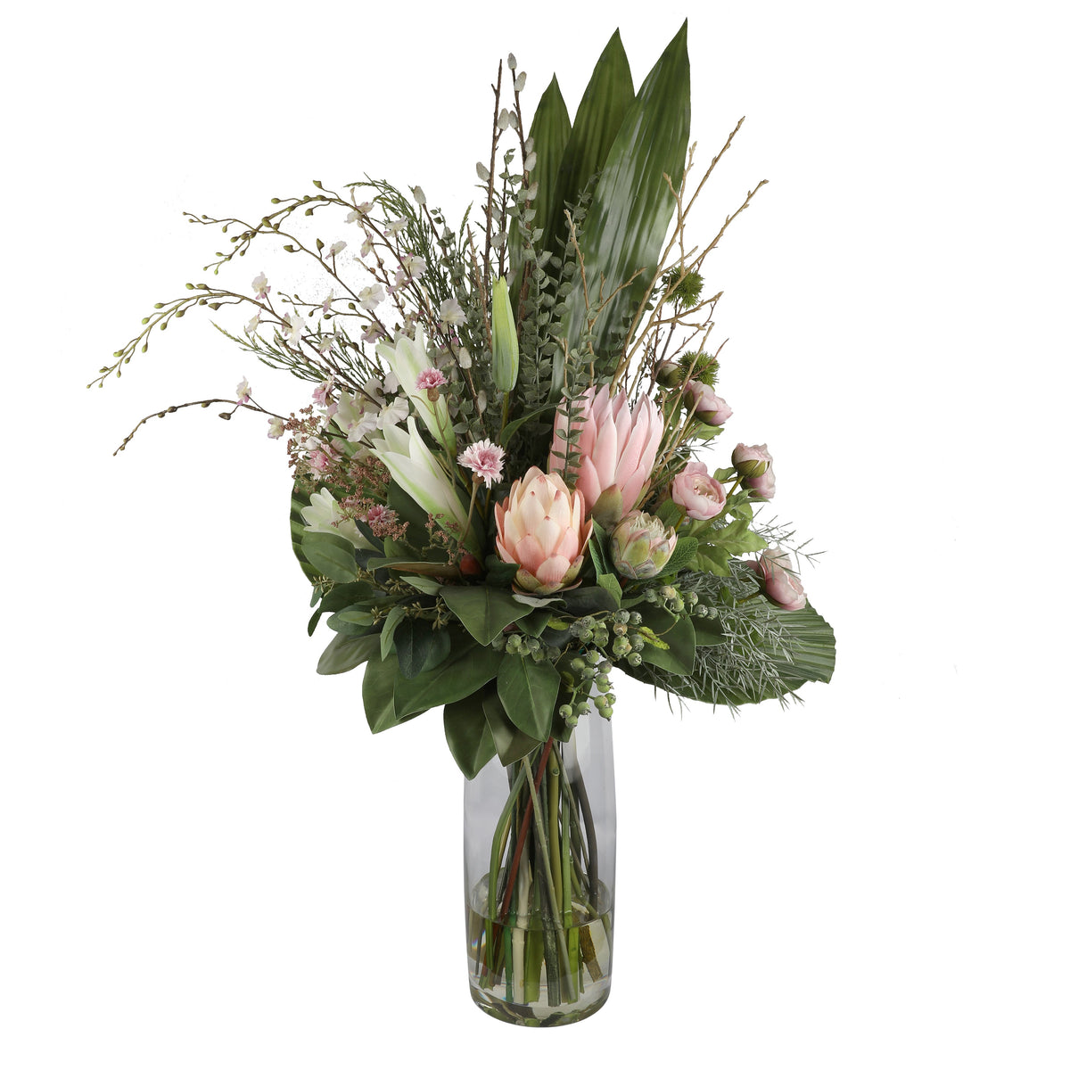 Blush Protea and Ranunculus Ethereal Artificial Arrangement with blush pink king protea, pink ranunculus buds, white oriental lilies, pink asters, and wild foliage in a tall glass cylinder vase