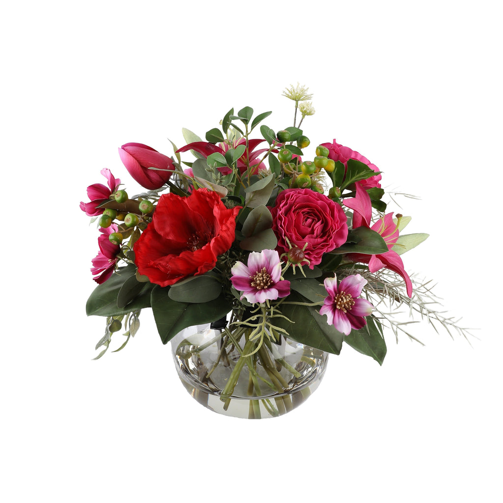 Crimson Passion Artificial Bouquet with red amaryllis, deep pink roses, magenta tulips, cosmos, and green berries in a glass fishbowl vase