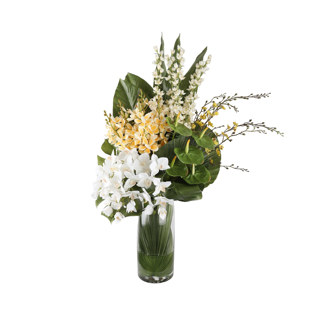 Orchid Gallery Artificial Arrangement with white phalaenopsis orchids, yellow cymbidium orchids, white dendrobium orchids, yellow oncidium orchids, and large monstera leaves in a tall glass cylinder vase