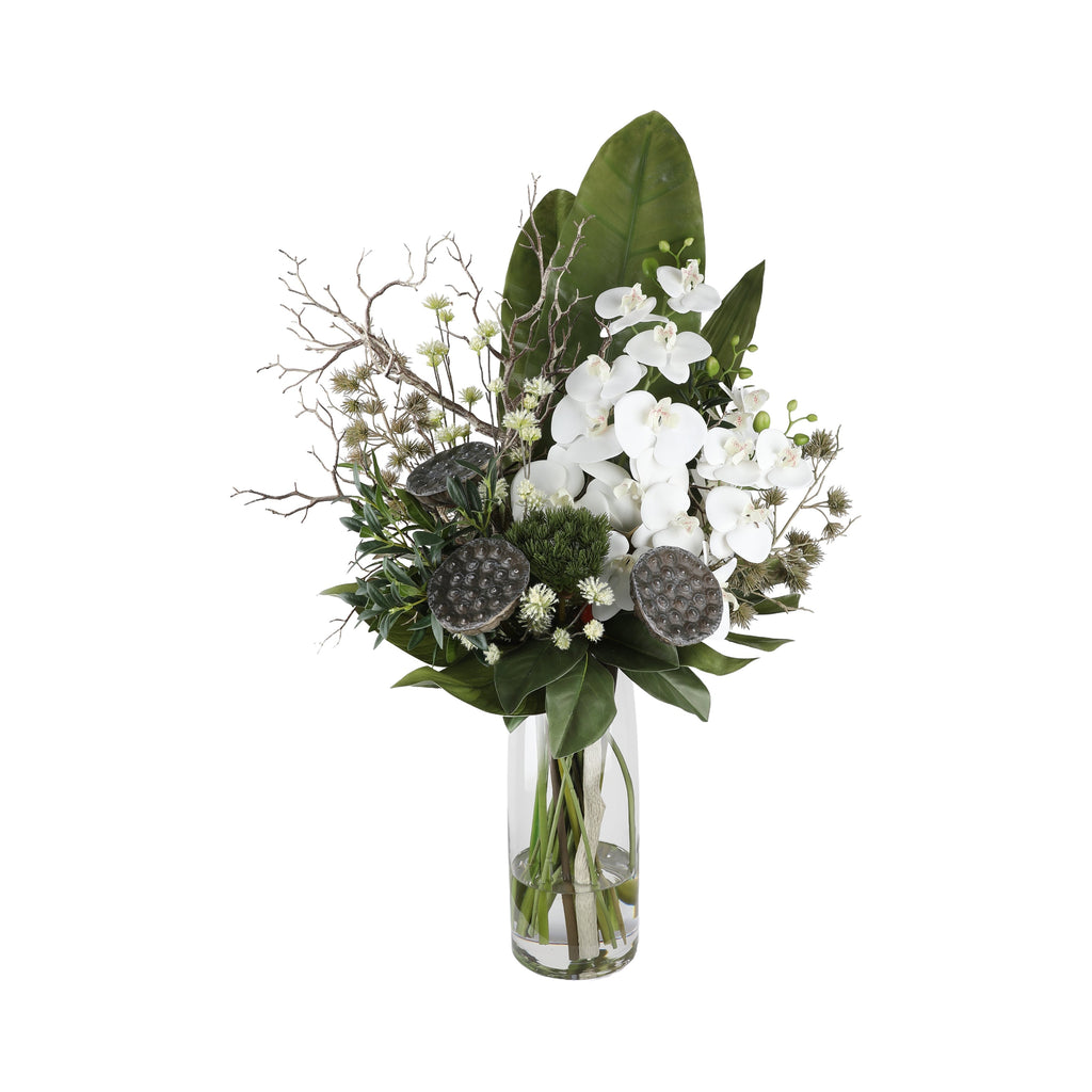 Zen Orchid and Lotus Artificial Arrangement with white phalaenopsis orchids, dried lotus seed pods, silver eryngium thistle, white wax flowers, silver branches, and magnolia leaf in a tall glass cylinder vase