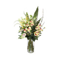 Cream Cymbidium Orchid and Calla Lily Artificial Arrangement with cream and yellow cymbidium orchids, yellow oncidium orchids, green calla lilies, blush anthurium, and white wax flowers in a tall glass cylinder vase