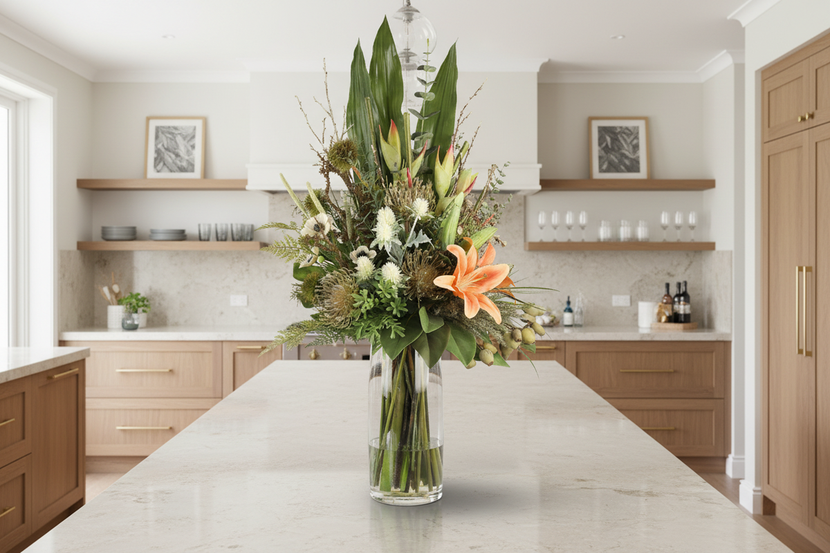 Peach Lily and Anemone Wild Garden artificial arrangement in a tall clear glass cylinder vase on a living room sideboard, large 90x40 cm scale