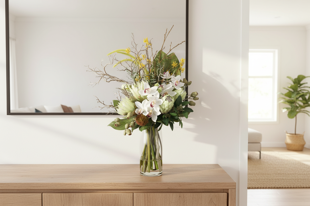 Bush Luxe large artificial arrangement matching the supplied reference, compact upright form in a clear cylinder vase on an entryway console, 90 x 40 cm