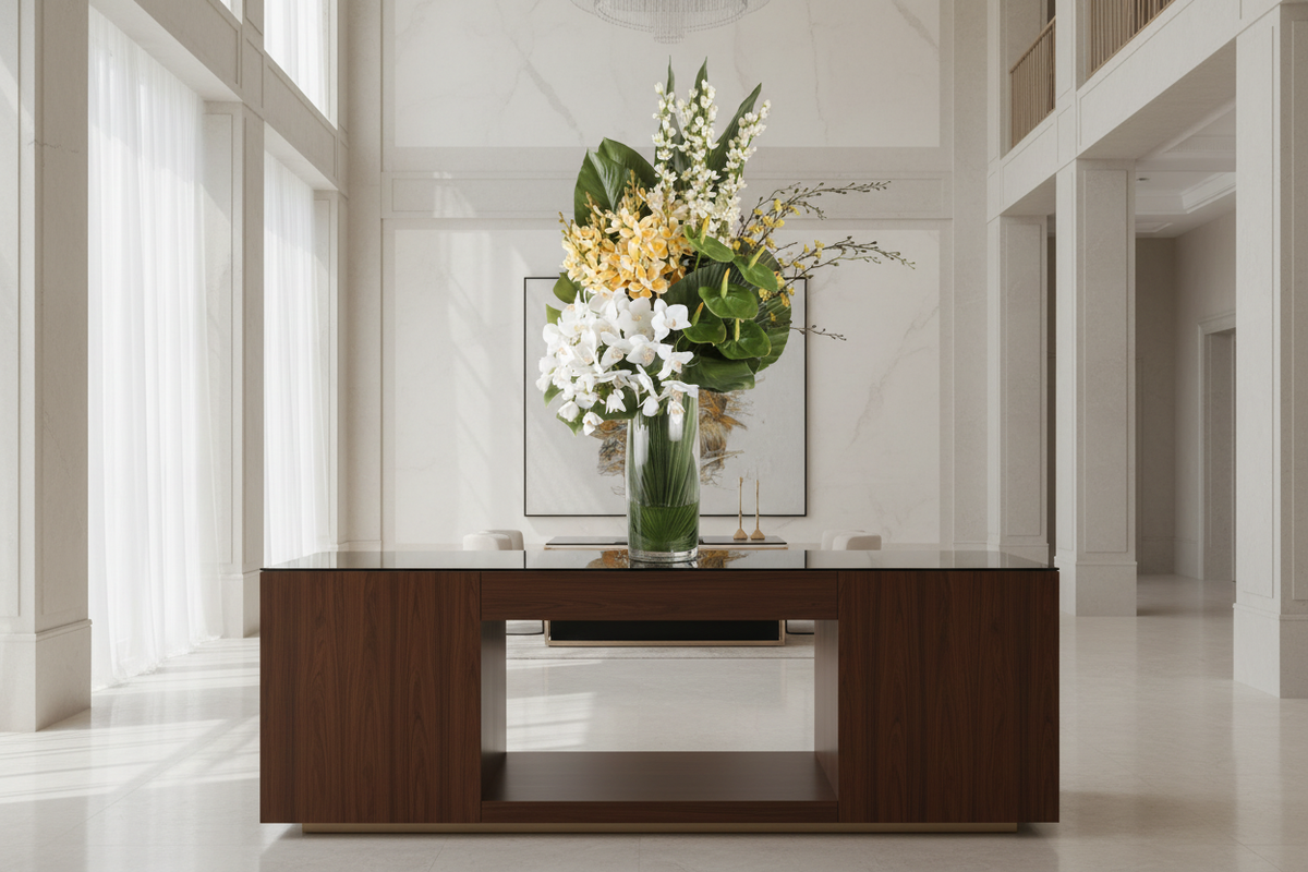 Orchid Gallery extra-large artificial arrangement on a luxury entryway console, grounded in a tall glass cylinder vase, 90 x 40 cm