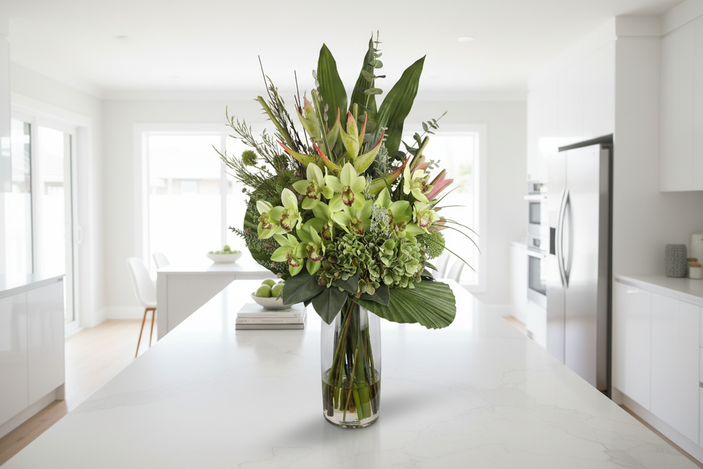 Green Cymbidium Orchid and Hydrangea Tropical artificial arrangement on a kitchen island