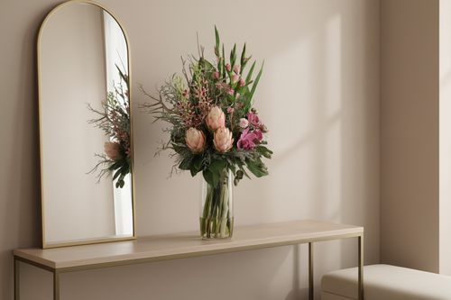 Blush King Protea and Orchid Wild Romance artificial arrangement in a neutral entryway