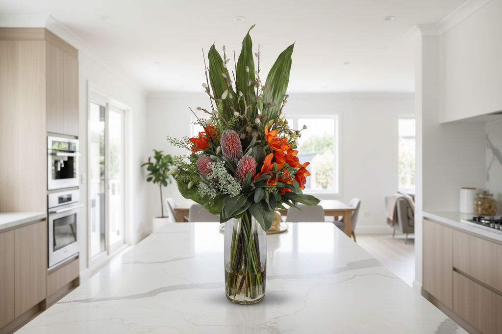 Orange Orchid and Pincushion Protea Wild Exotic artificial arrangement on a kitchen island