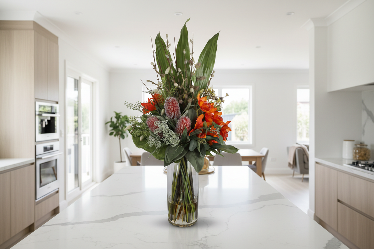 Orange Orchid and Pincushion Protea Wild Exotic artificial arrangement on a kitchen island